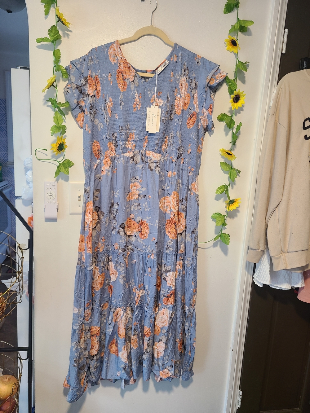 Keluummi light blue and orange floral maxi dress featuring a smocked bodice, ruf